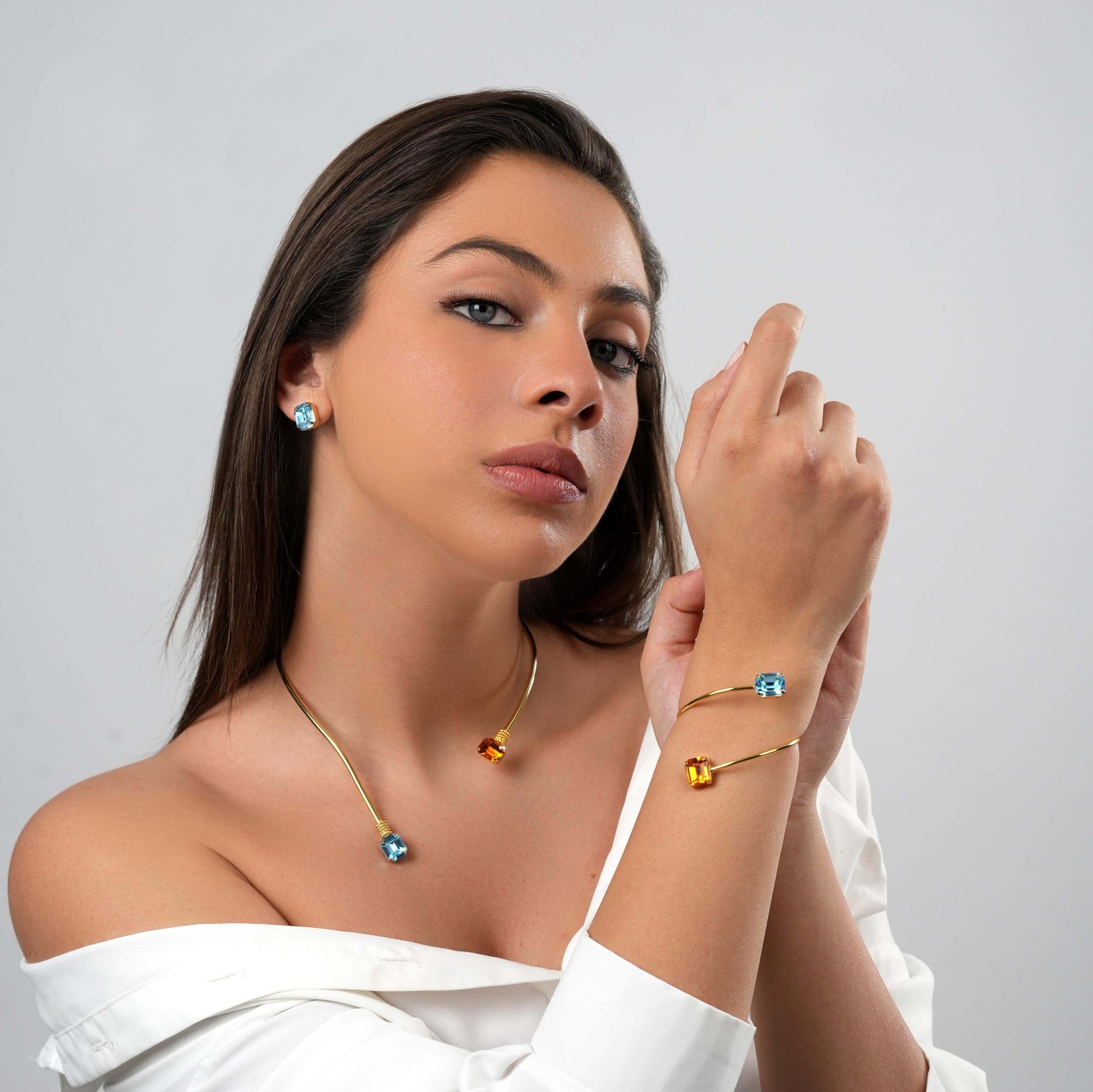 Amara Bangle Bracelet – 24k gold-plated bracelet with aquamarine and topaz Swarovski crystal accents